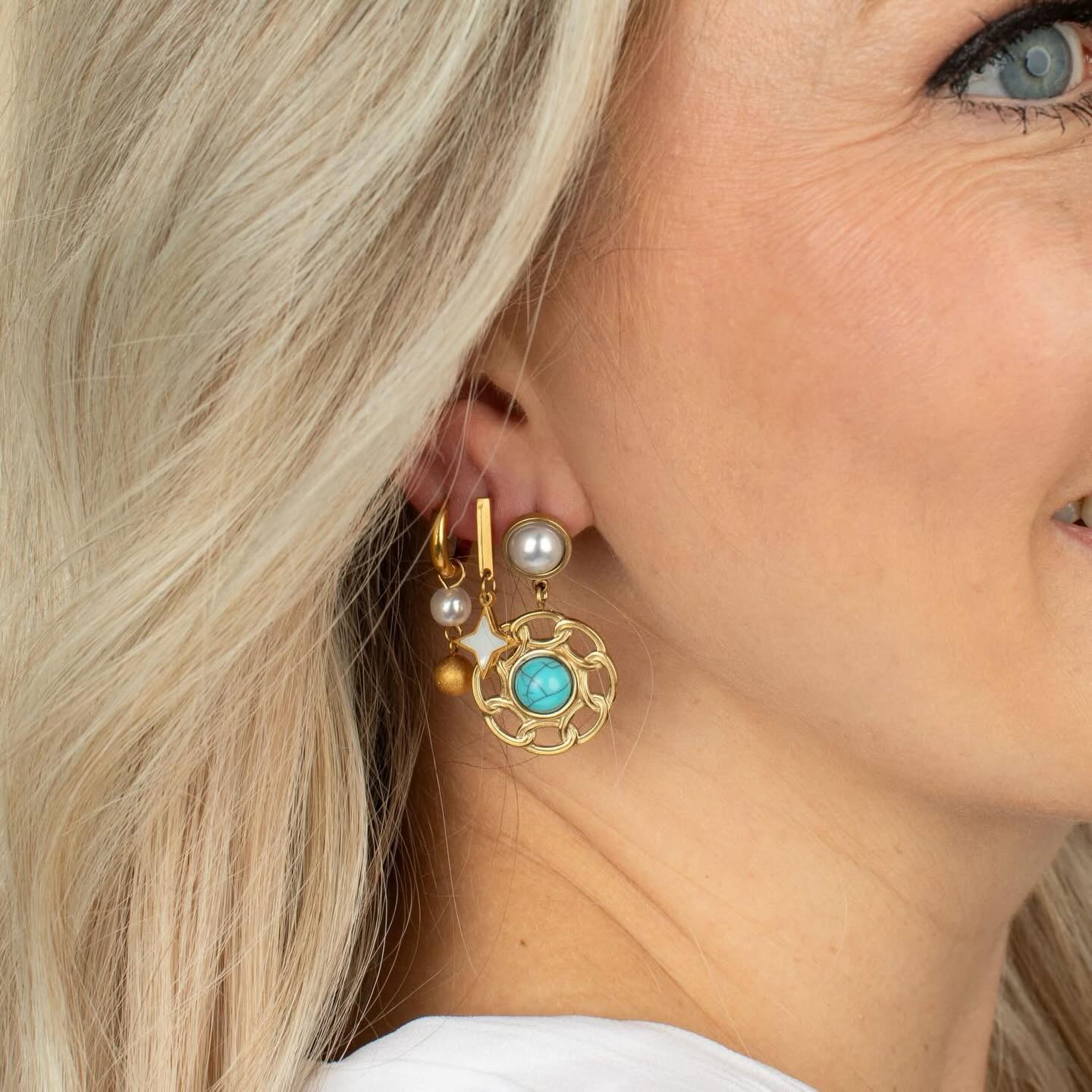 There are no rules when it comes to your earring combo 🌟🩵 mix it up, add pops of color, and just have fun with it! Curious? How many ear piercings do you have?